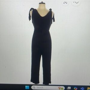 Lisa & Lucy black pant jumpsuit with tie shoulders and adjustable tor belt.